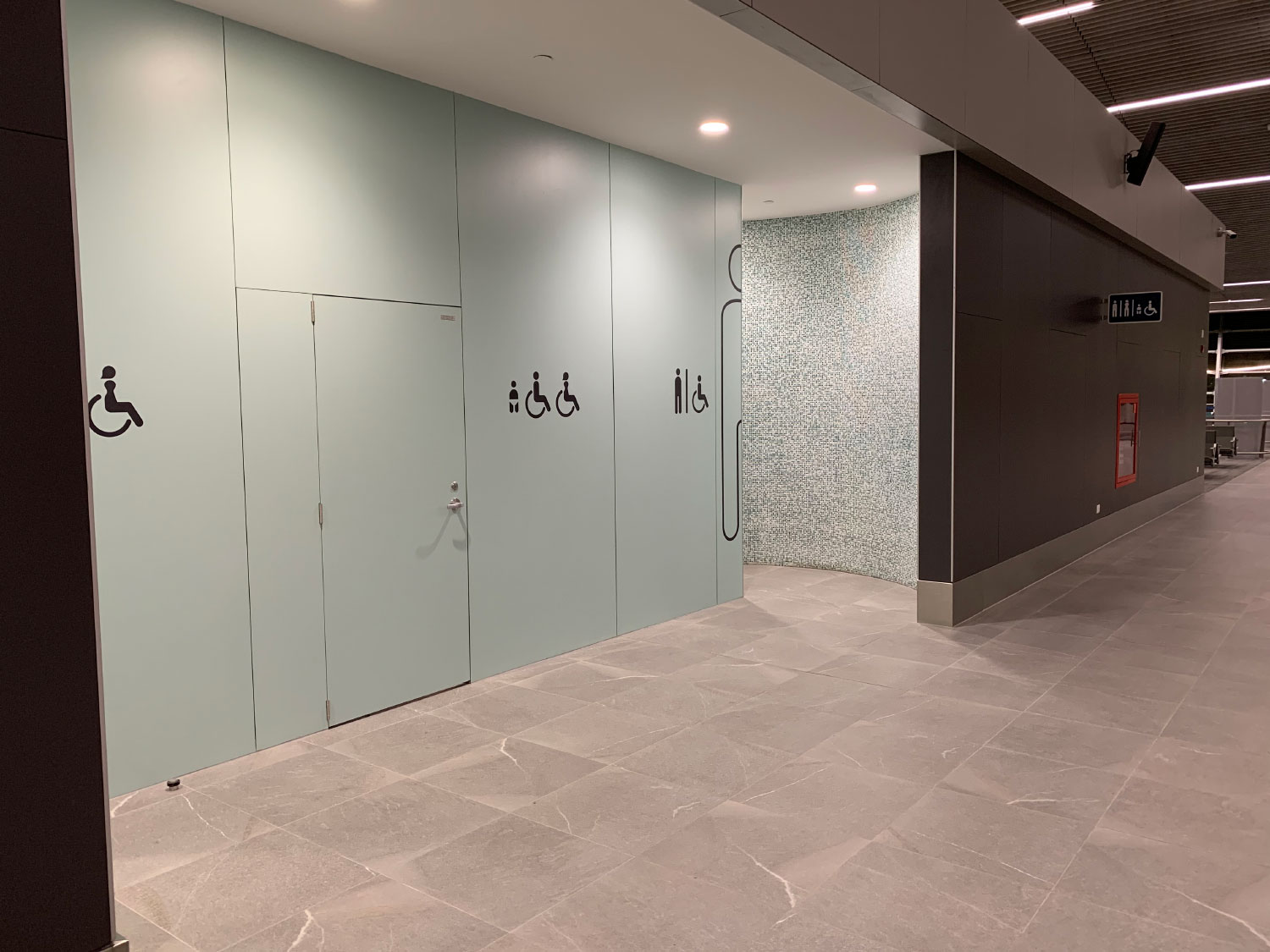 Airport bathroom entrance with Fundermax phenolic panels