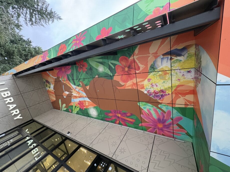 The phenolic facade on Midland Library in Portland, Oregon, featuring abstract designs of a hand and natural elements
